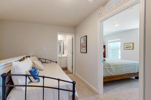 a bedroom with a bed and a mirror at Millville by the Sea --- 35015 Sunfish Ln in Millville +37 photos