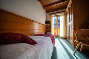 Postel nebo postele na pokoji v ubytování Hotel il Cardo