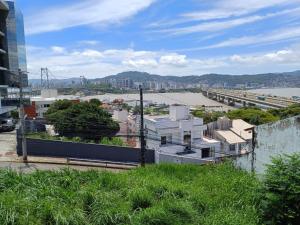 a view of a city with a river and buildings at Cantinho do Mané in Florianópolis