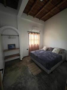 Ένα ή περισσότερα κρεβάτια σε δωμάτιο στο Casa Pelícano -suite albatros- +9 φωτογραφίες