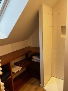 a room under the stairs with a closet at Ty Nid d'Amour Ty Matlo in Névez