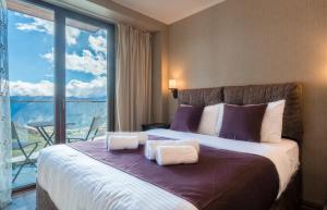 Ένα ή περισσότερα κρεβάτια σε δωμάτιο στο Winterfell in New Gudauri