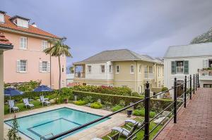 a house with a swimming pool in a yard at Charming Coastal Townhouse at The Majestic in Kalk Bay