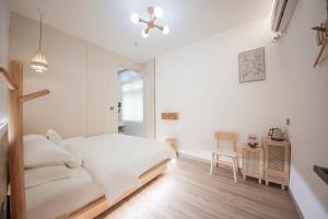 Meizhou Island Lijia Xiaoyuan B&B客房内的一张或多张床位