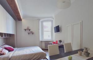 Televízia a/alebo spoločenská miestnosť v ubytovaní Conte Verde Apartments