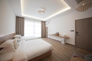 Meizhou Island Lijia Xiaoyuan B&B客房内的一张或多张床位