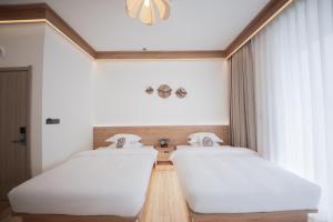 Meizhou Island Lijia Xiaoyuan B&B客房内的一张或多张床位