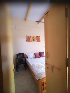Postel nebo postele na pokoji v ubytování Sukoon River Homestay