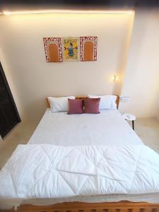 Postel nebo postele na pokoji v ubytování Sukoon River Homestay