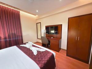 Postel nebo postele na pokoji v ubytování Park Avenue Hotel & Apartments Trichy