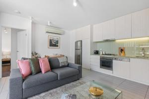 A kitchen or kitchenette at Chic 1-Bed with Harbour Views & Pool by Tram Line