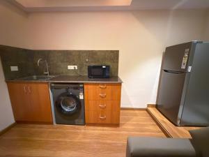 Kuchyň nebo kuchyňský kout v ubytování Park Avenue Hotel & Apartments Trichy