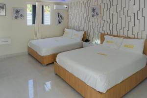 Postel nebo postele na pokoji v ubytování Hotel1325