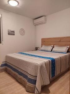 a bedroom with a large bed in a room at Apartment near sea Nortico 5 Torrevieja Spain in Torrevieja