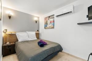Postel nebo postele na pokoji v ubytování Le Minuty + 11 fotografií