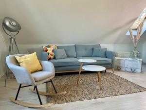Posezení v ubytování discovAIR Graal Müritz- Apartment Johanna- Strandnah mit Netflix