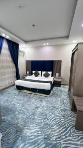 Ένα ή περισσότερα κρεβάτια σε δωμάτιο στο Quel Serviced Units