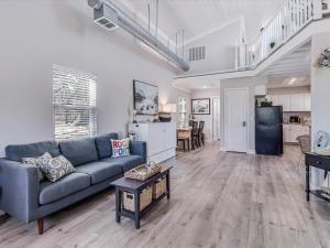 a living room with a couch and a table at Simon Michael Art Studio in Rockport