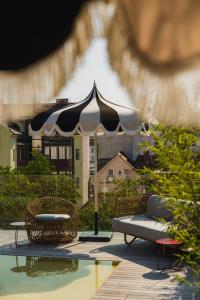 a black and white umbrella sitting next to a pool at AS Boutique Hotel, superior in Ljubljana