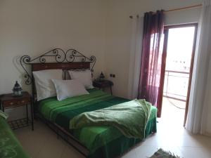 APPART AIGLE HOTEL客房内的一张或多张床位