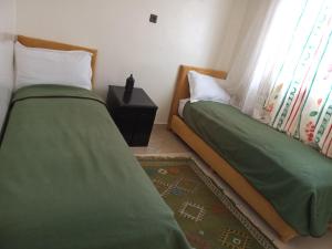 APPART AIGLE HOTEL客房内的一张或多张床位