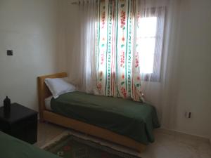 APPART AIGLE HOTEL客房内的一张或多张床位
