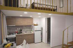 Kuchyň nebo kuchyňský kout v ubytování Aimou Studio's Apartment's