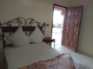 APPART AIGLE HOTEL客房内的一张或多张床位