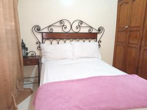 APPART AIGLE HOTEL客房内的一张或多张床位