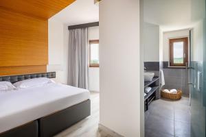 Postel nebo postele na pokoji v ubytování Precise House Montaperti Siena