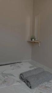 Ένα ή περισσότερα κρεβάτια σε δωμάτιο στο D'Kaira Homestay