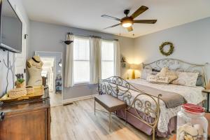 a bedroom with a bed and a ceiling fan at 3 Blocks to Beach and Potomac River Virginia Escape in Colonial Beach