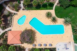 an aerial view of a resort with a swimming pool at Sol & Lar No stress in Santa Maria