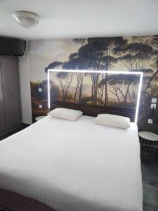 Кровать или кровати в номере Hôtel de l'Europe
