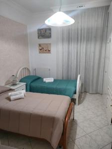 Posteľ alebo postele v izbe v ubytovaní La casa della Vittoria
