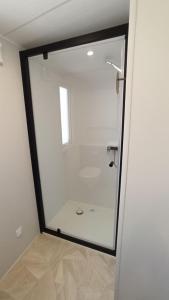 a bathroom with a shower with a glass door at Sea View Amazing in Saint-Raphaël +39 photos