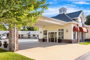 a house with a driveway in front of it at Best Western of Harbor Springs in Harbor Springs