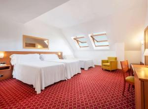 Postel nebo postele na pokoji v ubytování Hotel Zentral León