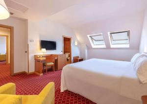 Postel nebo postele na pokoji v ubytování Hotel Zentral León