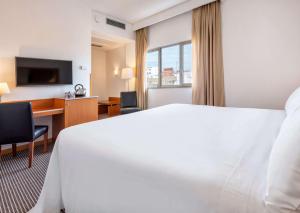 TV a/nebo společenská místnost v ubytování Hotel Zentral León