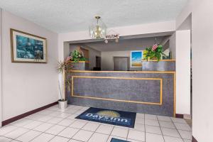a lobby with a dallas team sign on the floor at Days Inn by Wyndham Clayton in Clayton +35 photos