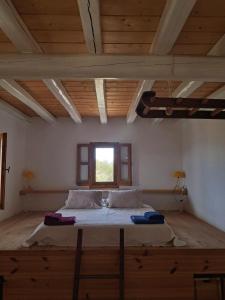 Ένα ή περισσότερα κρεβάτια σε δωμάτιο στο Casa Anemousa, tra cielo e mare