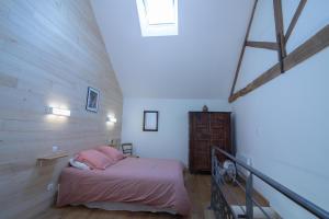 Letto o letti in una camera di Le Clos du Barry