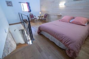 Letto o letti in una camera di Le Clos du Barry