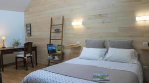 Letto o letti in una camera di Le Clos du Barry