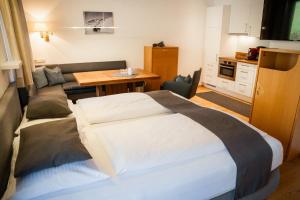 Postel nebo postele na pokoji v ubytování Aparthotel Pfeffermühle + 37 fotografií