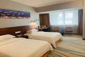 Ένα ή περισσότερα κρεβάτια σε δωμάτιο στο Days Inn Guangzhou +76 φωτογραφίες