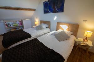 Letto o letti in una camera di Le Clos du Barry
