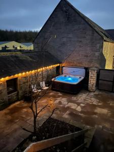 an overhead view of a backyard with a hot tub at Stewards Granary in Cornhill-on-tweed