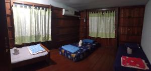 Postel nebo postele na pokoji v ubytování Lungmin homestay